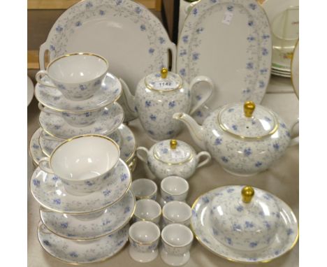 A Bavarian Amorette Schindling breakfast service, comprising teapot, coffee pot, butter dish and cover, six teacups and sauce