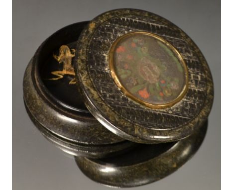  A Victorian moulded circular snuff box, the push on cover inset with an embroidered basket of English country flowers, marbl