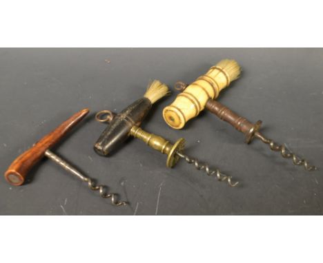 A Georgian ivory handled corkscrew; two others (3)