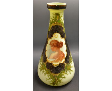 A late 19th century French green glass vase, decorated with an oval portrait panel of a maiden, within green black and gilt f