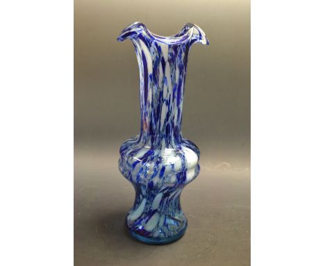 A tall late 19th/early 20th century ovoid glass vase, undulating rim, mottled light and dark blue, 31cm high 