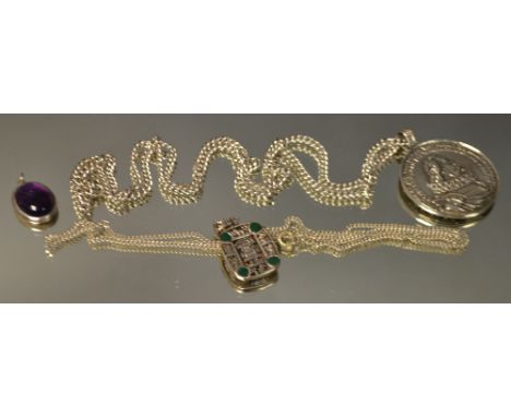 A silver souvenir Spanish Armada pendant and chain; a Mayan type pendant; etc (3)
