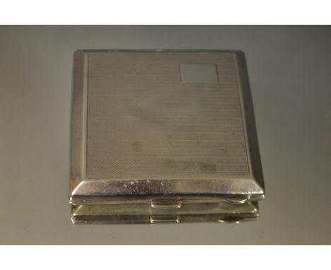 An Art Deco Henry Matthews silver cigarette case, engine turned, gilt interior, Birmingham 1929