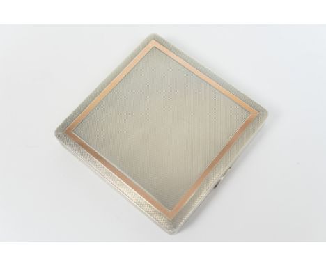 Silver compact, Birmingham 1956, square form with engine turned decoration and gold plated border, 7cm
