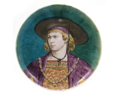 Theodore Deck (French) circular plaque, decorated with a Medici style portrait of a young man in colours against a shaded blu