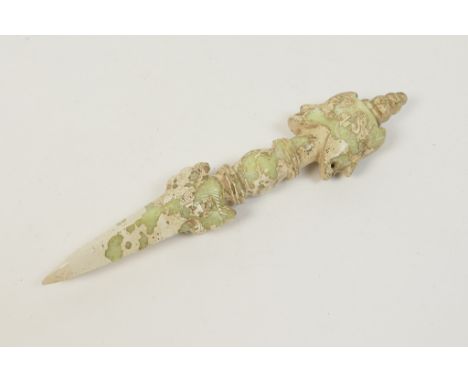 Sino-Tibetan jade phurba, 19th Century or later, very pale variegated green, the pommel bearing the two faces of Vajrakila, t