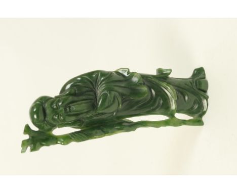 Oriental spinach green jade standing figure of Shou-Lao, traditionally carved carrying a peach and a sprouting staff in the r