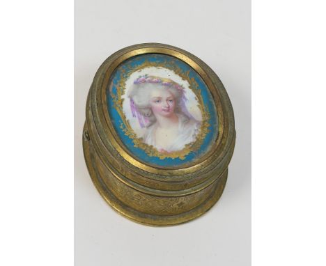 French brass and Sevres panel ring box, circa 1870, the oval porcelain panel decorated with a portrait of a young woman with 