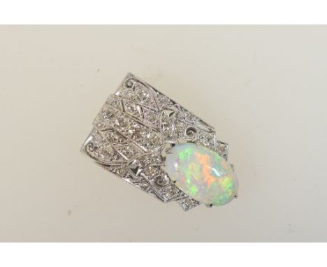 Belle Epoque opal and diamond clip, the oval cabochon opal approx. 16mm x 9mm, set against an old brilliant cut diamond encru