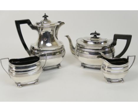 George V silver four piece tea service, Sheffield 1928-9, comprising teapot and hot water jug with ebony finial and handle, d