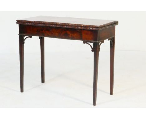 George III mahogany folding tea table in the Chippendale style, rectangular top supported on a folding gate at the rear over 