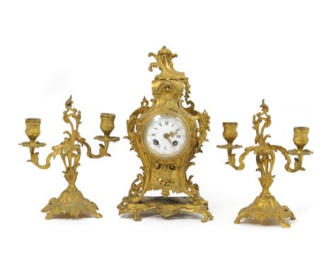 French gilt ormolu clock garniture by A D Mougin, circa 1890, Rococo Revival case embellished throughout with scrolls, floral