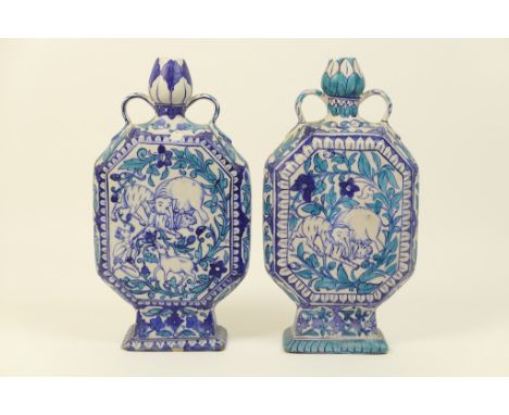 Matched pair of Persian faience octagonal vases, late 19th Century, each decorated with panels of hunting animals and foliage