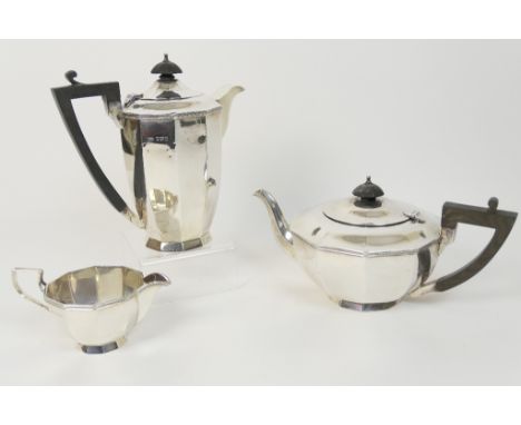 Walker & Hall silver three piece tea service, Sheffield 1930, comprising teapot with ebony finial and handle, hot water jug a