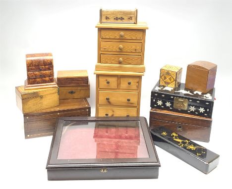 A 20th century mahogany table top bijouterie cabinet, the hinged glazed top opening to reveal a burgundy plush lined intrior,