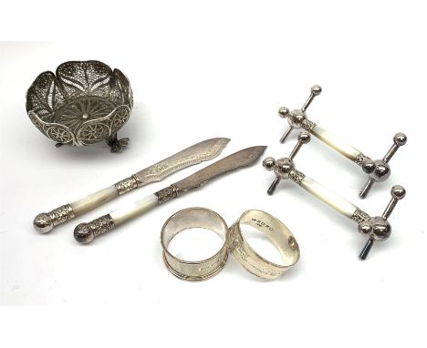 An unmarked silver filigree bon bon dish, D7.5cm, (a/f), together with two silver napkin rings, hallmarked Joseph Gloster Ltd