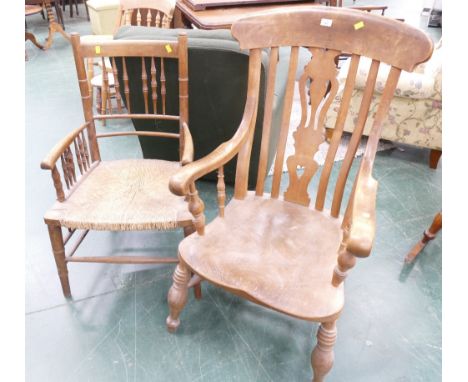 Sturdy oak armchair and rush seated oak spindle back chair 