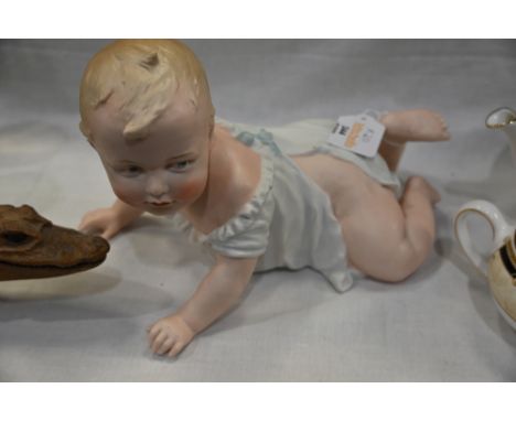 Continental Heubach porcelain Piano Baby, 25 cm long 