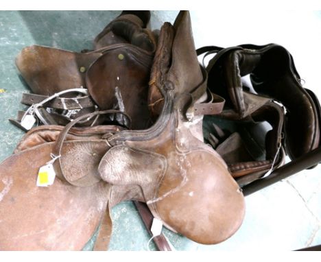 Four vintage leather saddles 