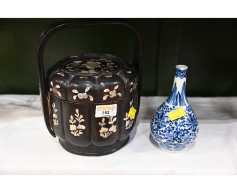 Black lacquered mother of pearl inlaid oriental basket, 23 cm high (handle loose), and small Chinese blue and white bud vase,