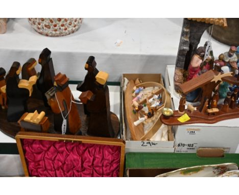 Four wooden and ceramic Nativity scenes, Christmas ornaments etc 