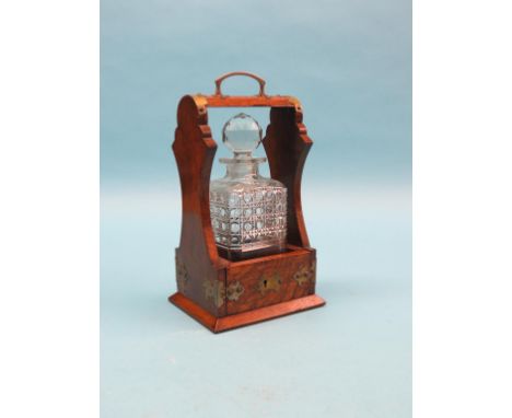 An unusual Victorian oak tantalus, with silver plated mounts, single, cut glass decanter with stopper, with key