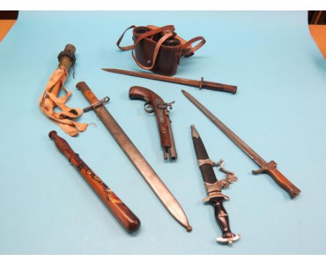 A German bayonet, Waffenfabrik Neuhausen serrated blade, in scabbard, two other bayonets, replica SS dagger, Victorian gilded