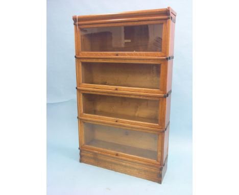 A Globe Wernicke medium oak bookcase, four glazed sections, 3ft.