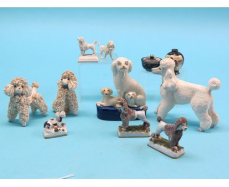 A pair of continental porcelain poodle models, seven other ceramic dog models and two miniature Satsuma enamelled pots 