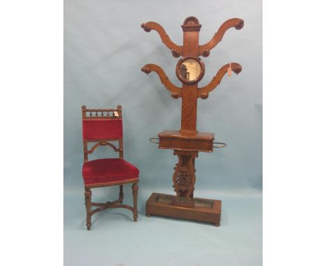 A Victorian oak hall-stand, featuring coat hooks, circular mirror, glove-box and stick-stand with drip-tray, 5ft. 6in. high, 