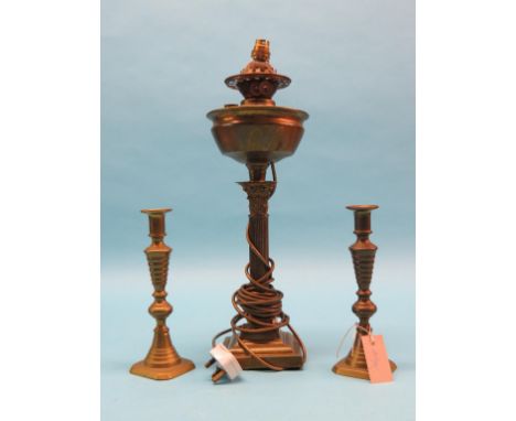 A Victorian Duplex brass oil lamp, with Corinthian stem and glass shade, and a pair of Victorian brass candlesticks 