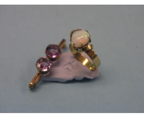 A 9ct. gold dress ring, claw-set with opal, size O, and a 9ct. gold twin-amethyst bar-brooch