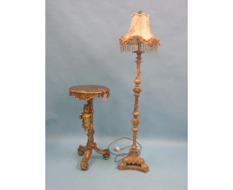 An 18th century-style giltwood gueridon, circular top on fluted and figural stem, tripod base, 1ft. 4in., together with a Lou