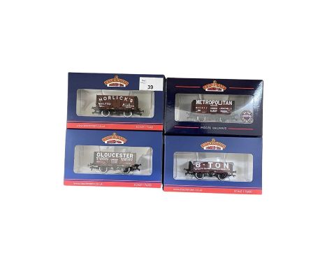 A mixed lot of four  Bachmann Branch-Line Exclusive Collectors Club 00 gauge wagons, to include: - 37-2016K 7 plank End Door 