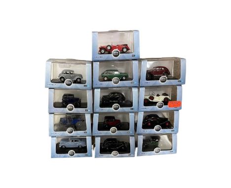 A collection of case die-cast automobile vehicles by Oxford