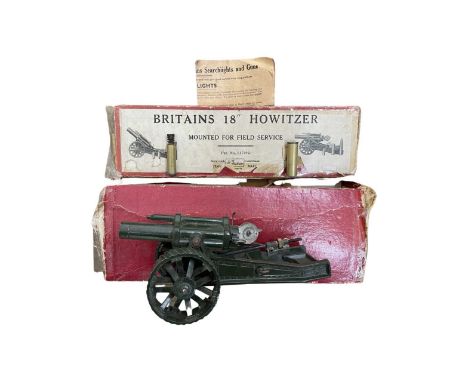 A boxed Britains 18'' Howitzer die-cast model, no 2107. Complete with original instruction manual, six shells, two shell-case