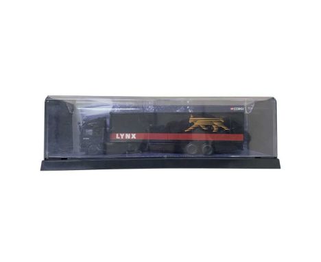 A display case containing a Corgi die-cast ERF EC Box Trailer: Lynx Express
