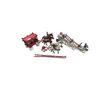 A reproduction cast iron cage circus wagon from Overlands Circus containing a panda with two heavy horses, together with a fu
