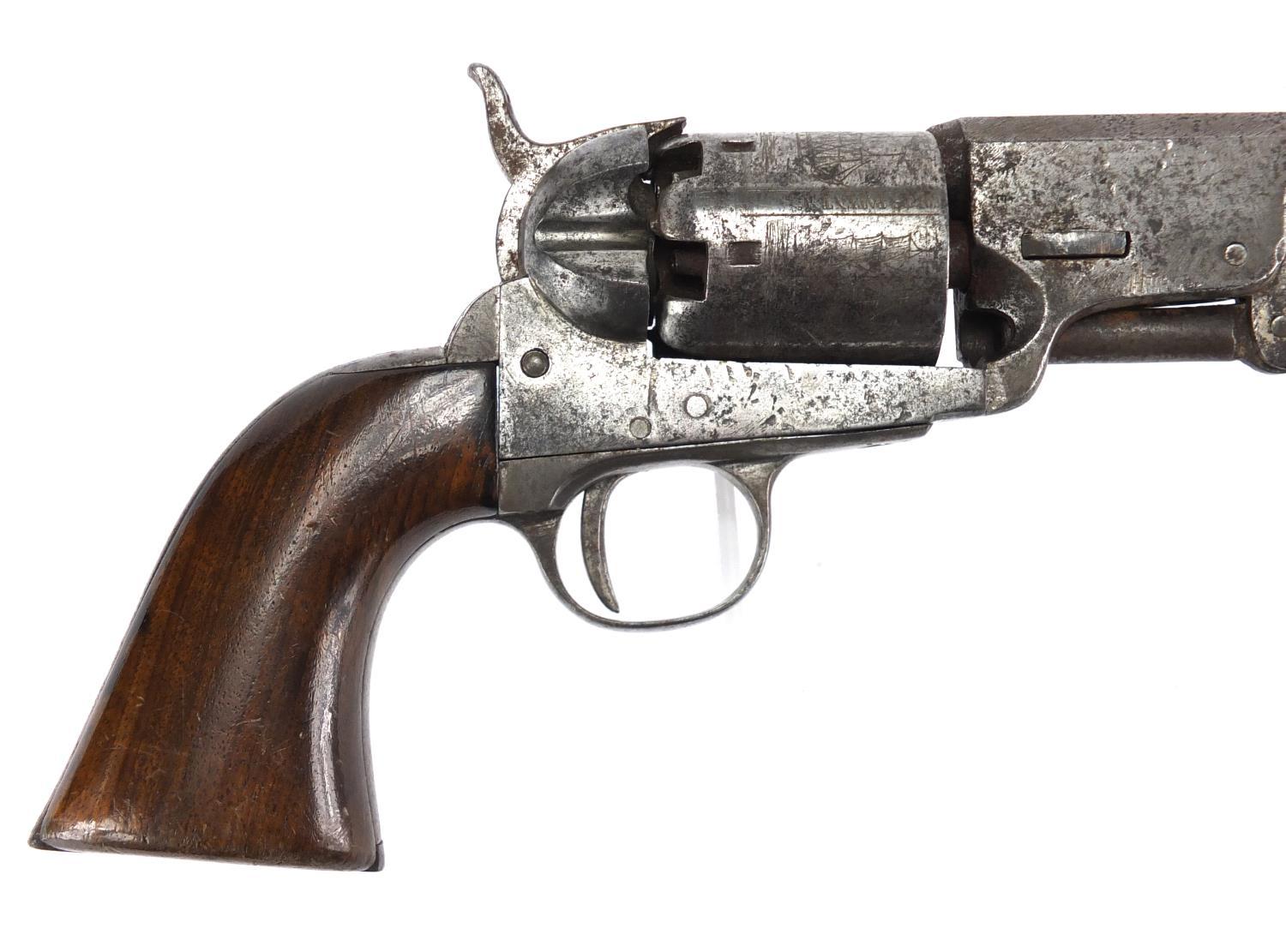 Colt patent revolver with wooden grip, the hexagonal barrel etched with ...