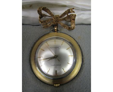 An Eterna-Matic Centendaire - manual wind nurse's watch, suspended on a 9ct gold bow brooch, cased, total weight of brooch 3.