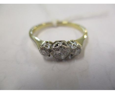 An 18ct gold three stone diamond ring 