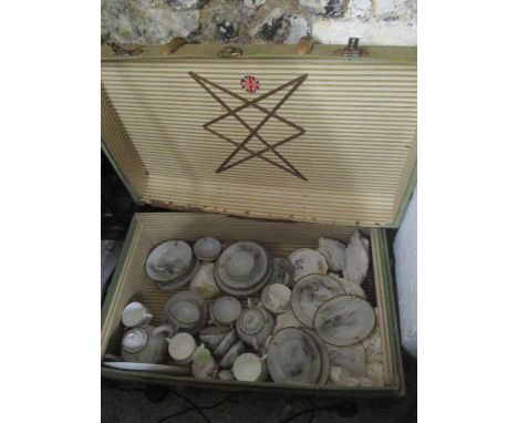 A vintage trunk containing mixed china to include a Noritake tea service and Wedgwood Devon sprays china 