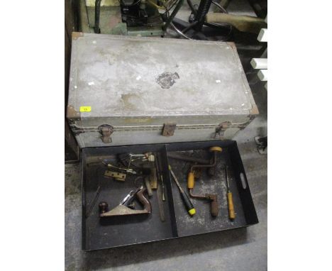 A vintage twin handled trunk containing mixed tools to include a records No 3 wood working plane 