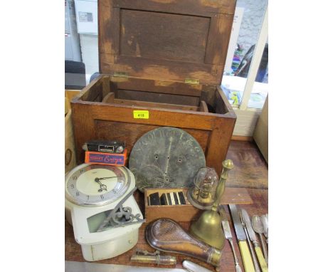A vintage oak box containing a copper powder puff, vintage bone dominoes, silver items, mixed metalware and a sundial, togeth
