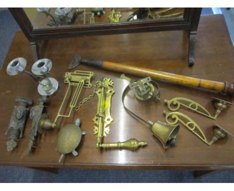 Early 20th century brass household and door furniture to include a bell, wall sconces and a door knocker, together with a mah