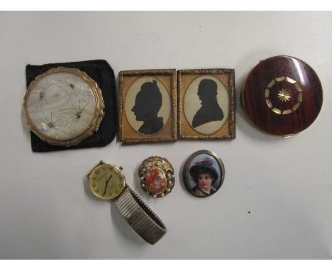 A group of costume jewellery, compacts, and 19th century silhouettes to include a French porcelain portrait plaque brooch, a 