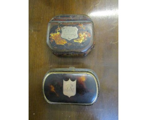 An early to mid Victorian tortoiseshell purse with yellow metal inlaid decoration and shield shaped cartouche, having engrave