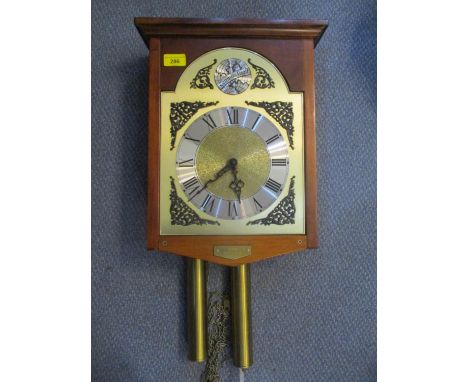 A modern mahogany cased wall hanging clock having silvered chapter ring with Roman numerals 