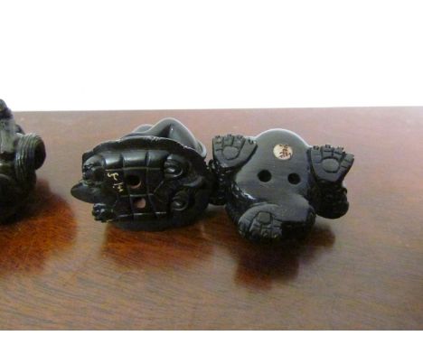 Four signed carved wood Netsuke 
