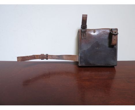 A leather cased sandwich box and flask